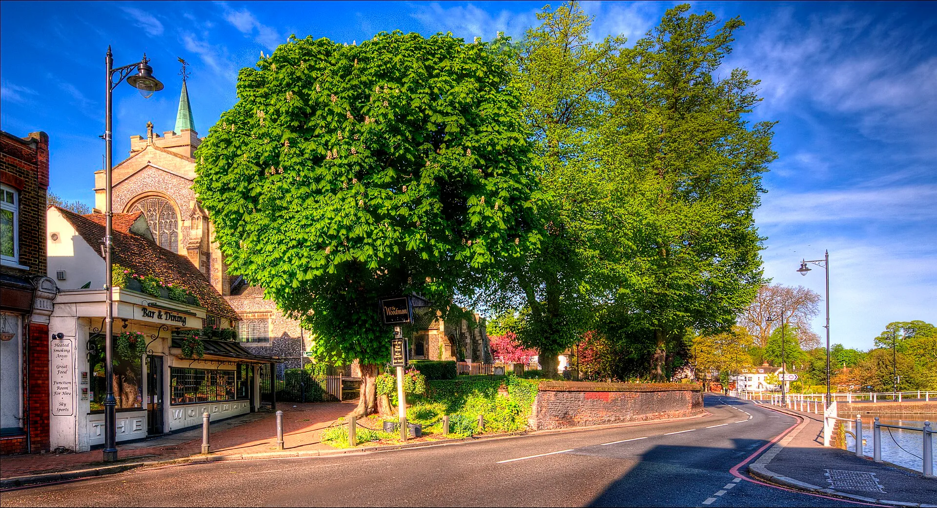 Carshalton - Carshalton Village including The Woodman & All Saints' Church with Honeywood House in the background.