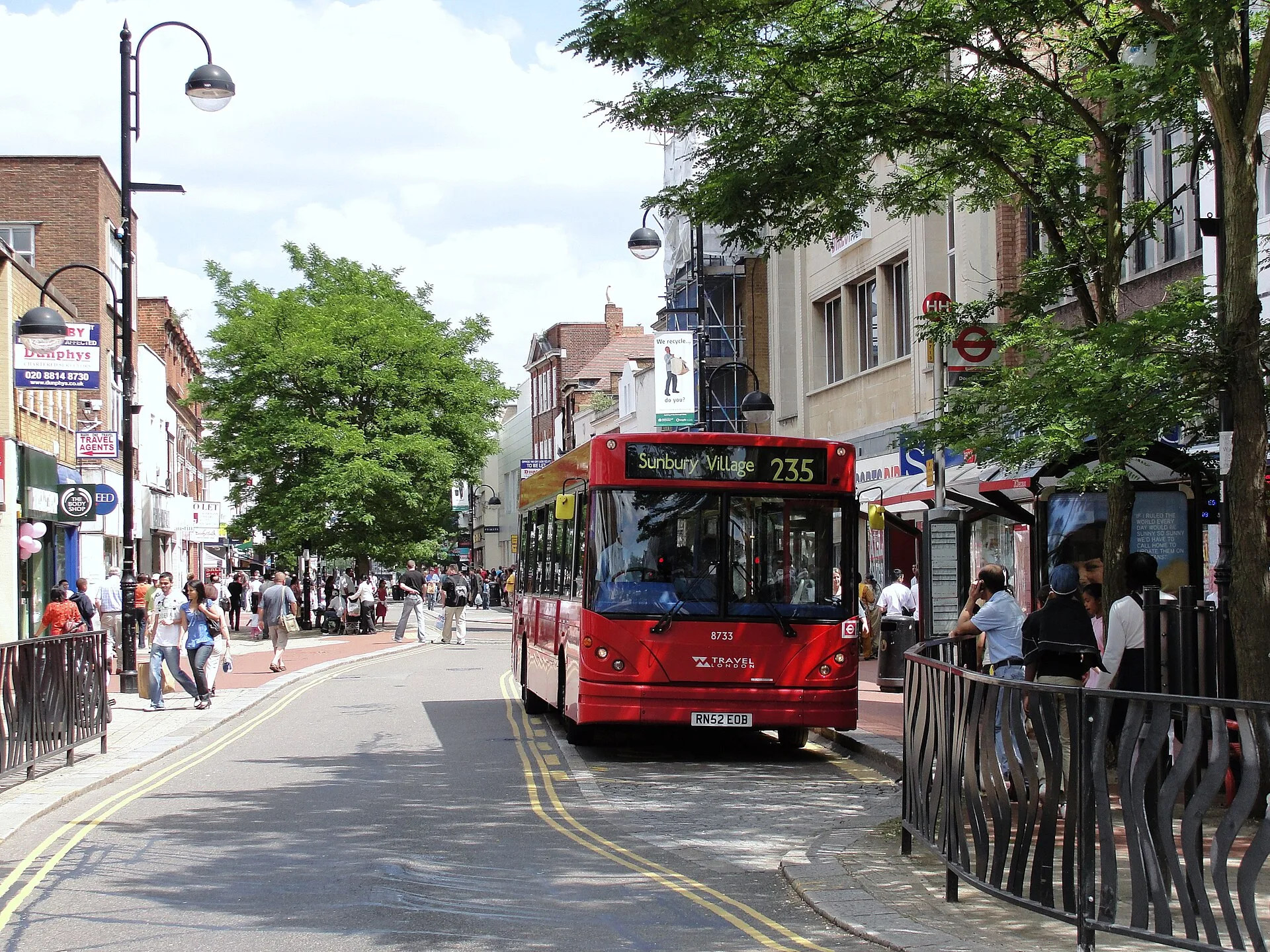 Hounslow - London 235 single decker bus, outside of W H Smith