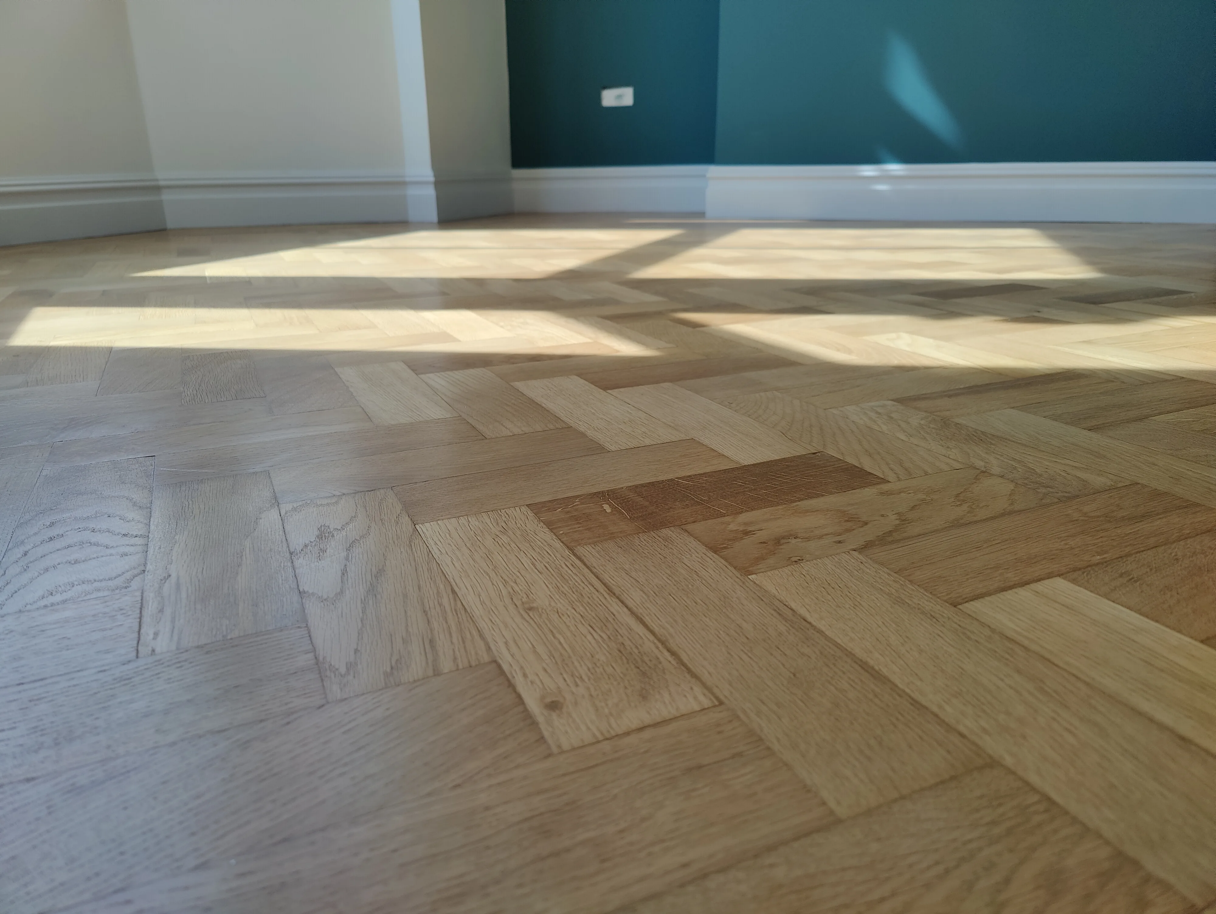 Bright wooden parquet flooring in a modern interior