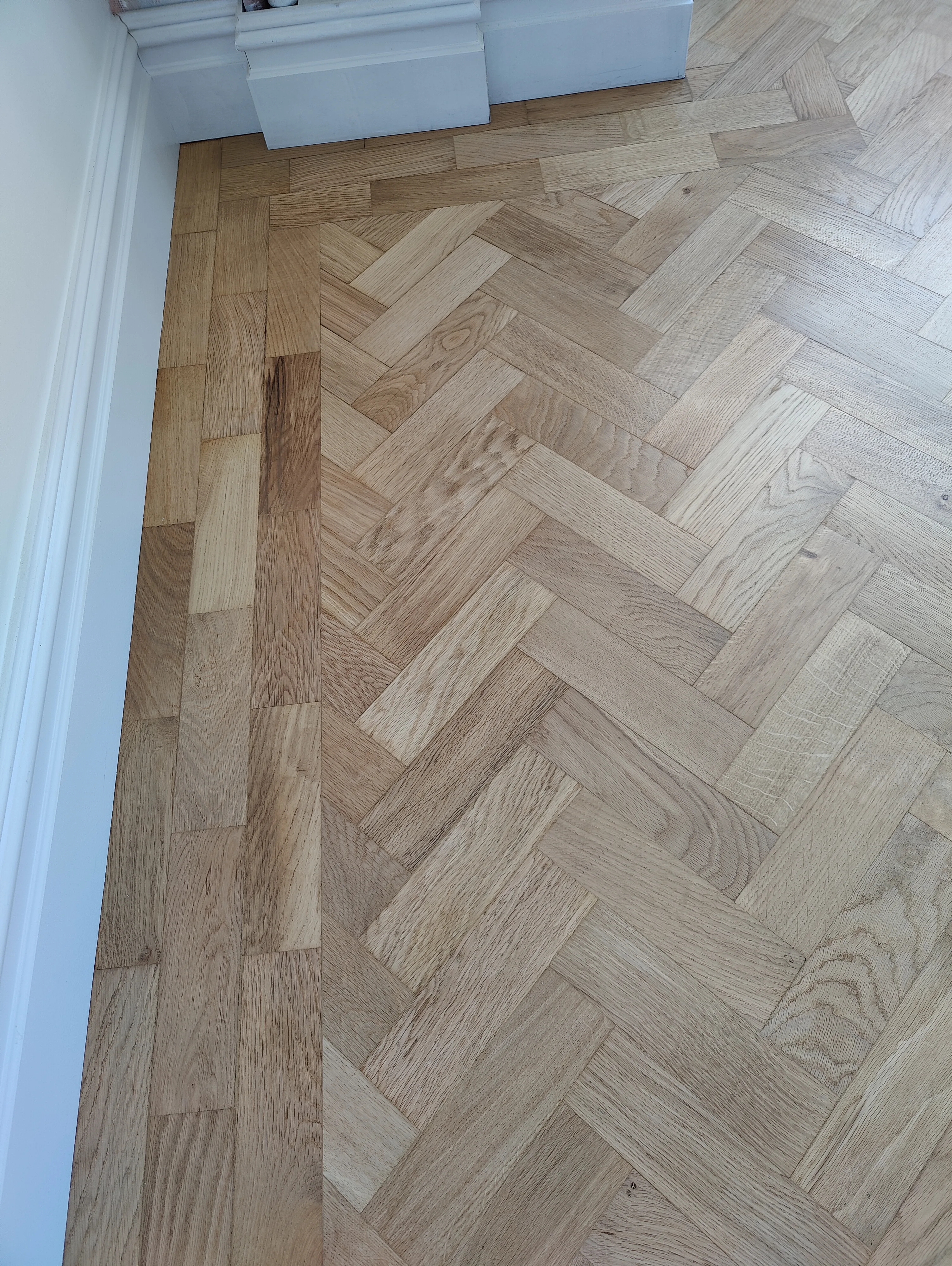 Close-up of polished parquet flooring installation in a residential room