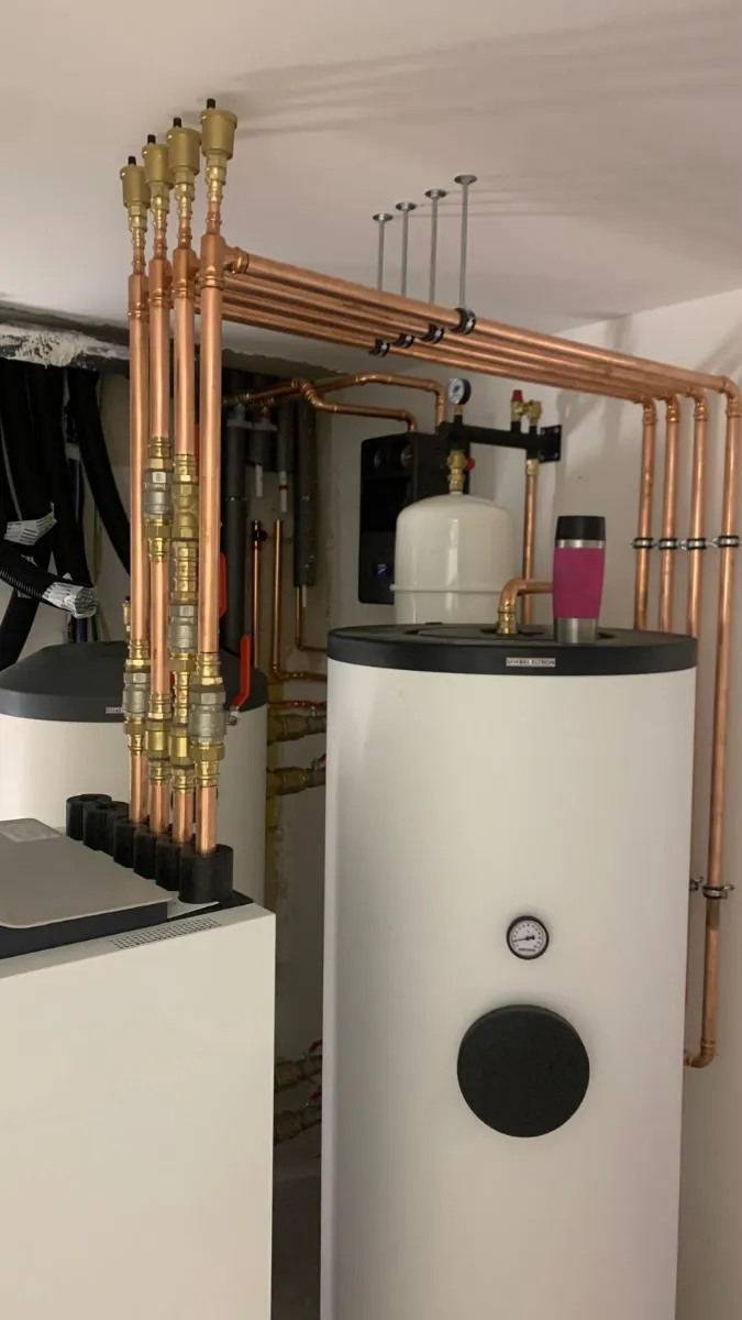 Copper piping installation in a residential plumbing system with water heaters