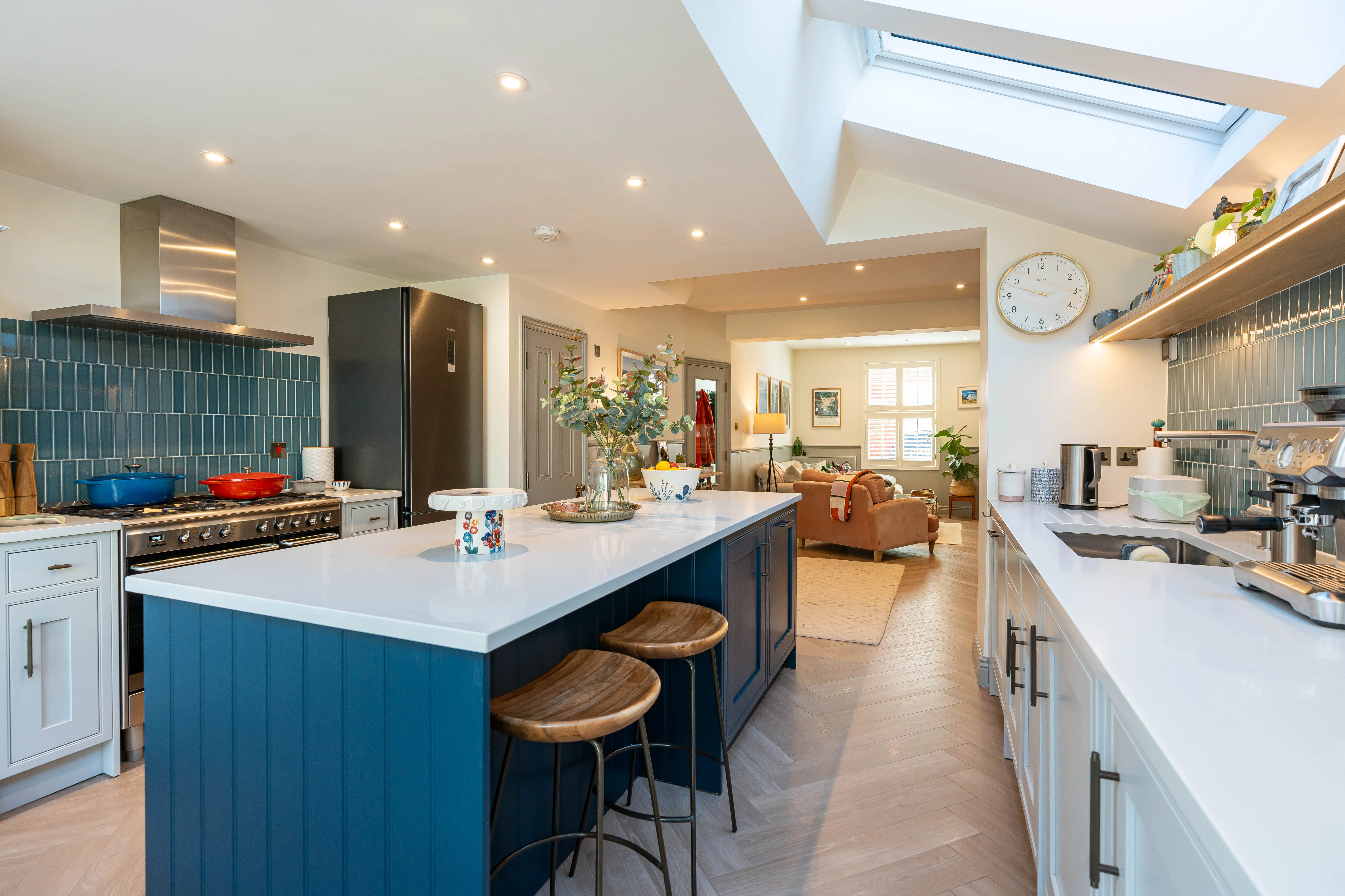 Modern kitchen refurbishment featuring a central island, stylish cabinetry, and ample lighting