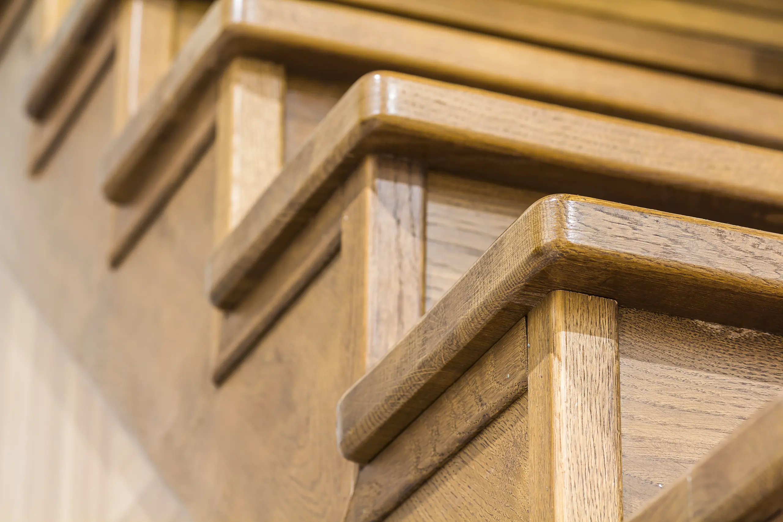 Close-up of oak stairs showcasing detailed craftsmanship and quality finish
