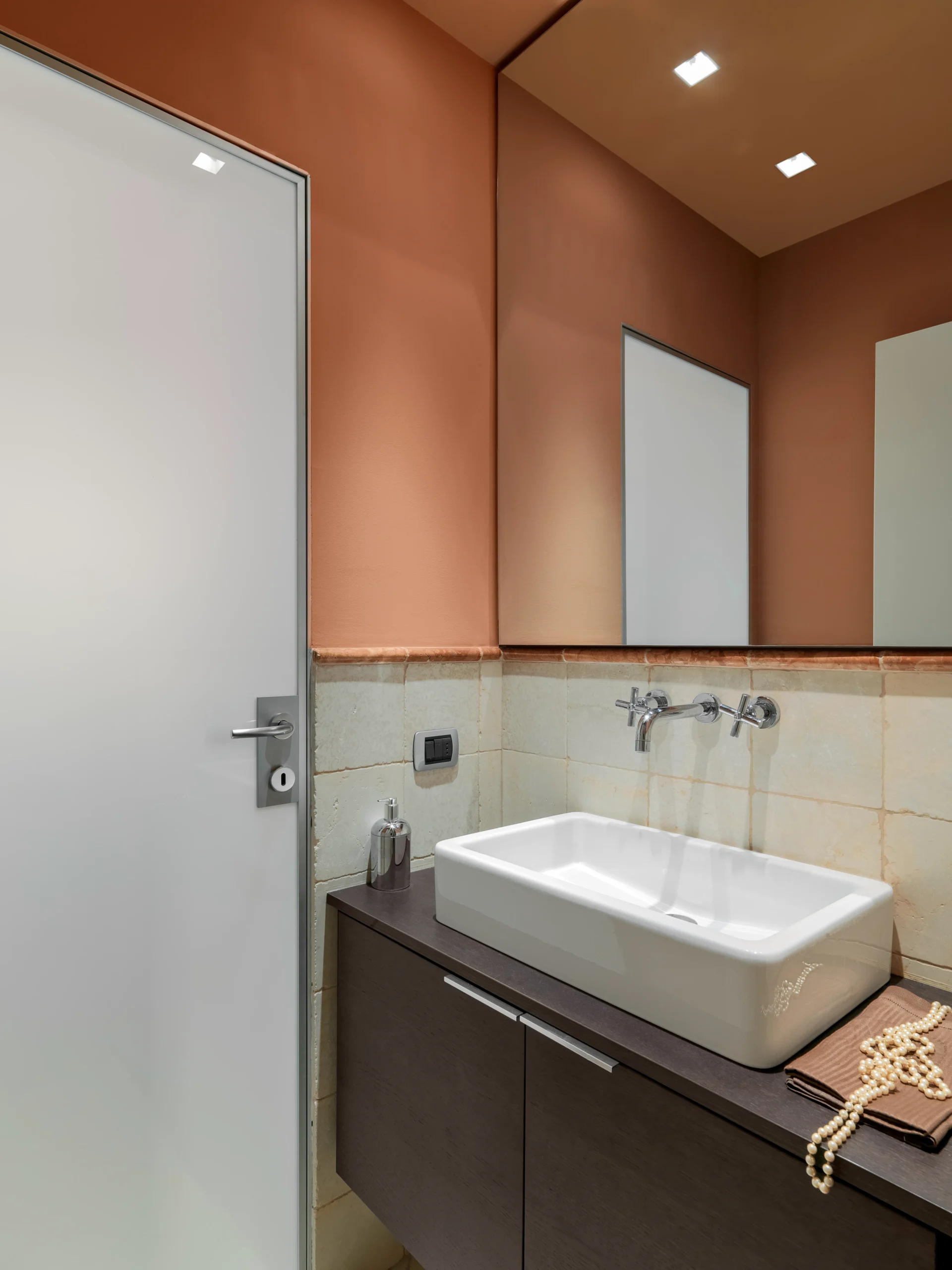 Modern bathroom with a sleek sink and wooden cabinetry