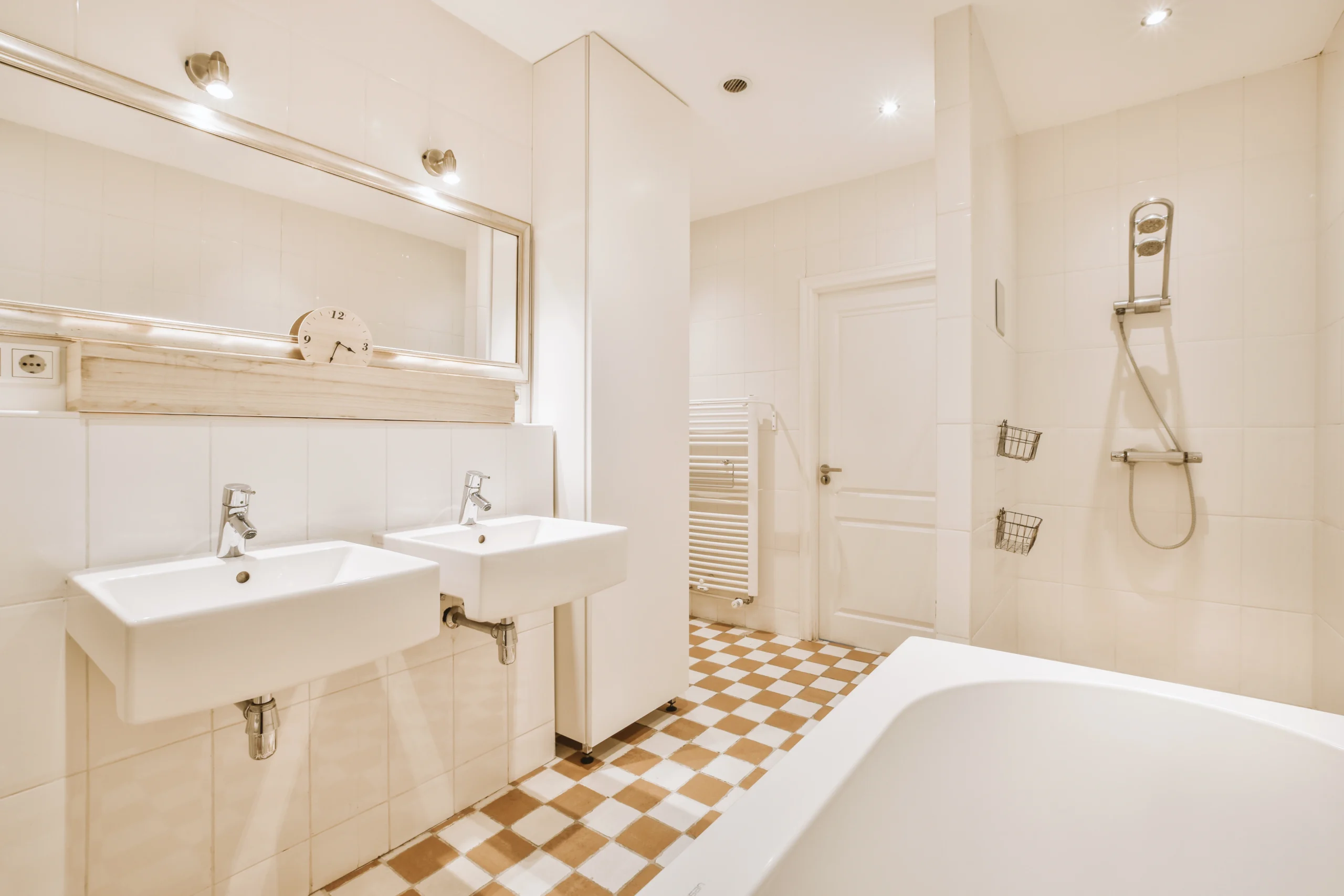 Modern bathroom refurbishment with double sinks and stylish tiles