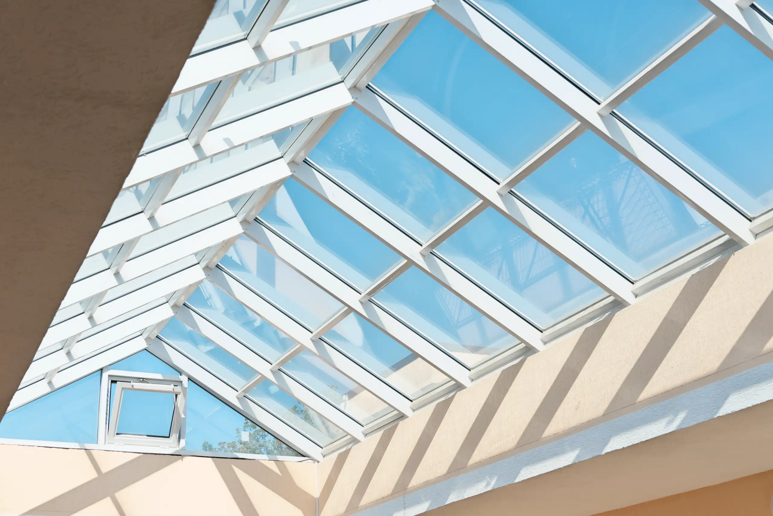Glass roof installation allowing natural light into the space