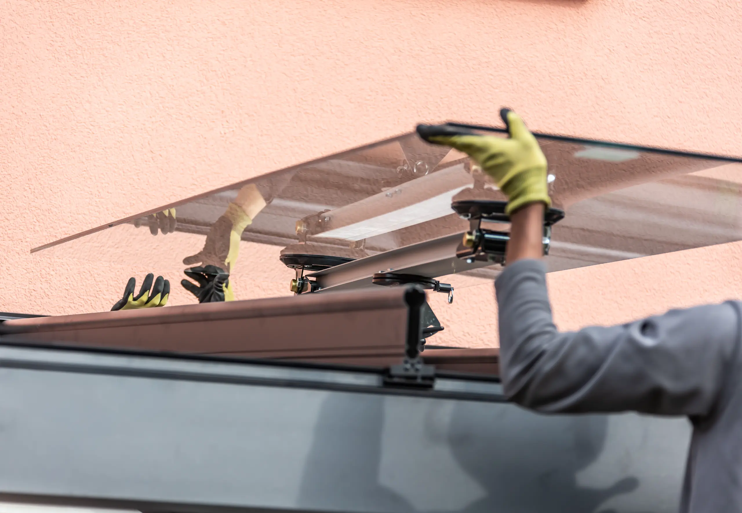 Installing a glass roof panel with precise handling and support