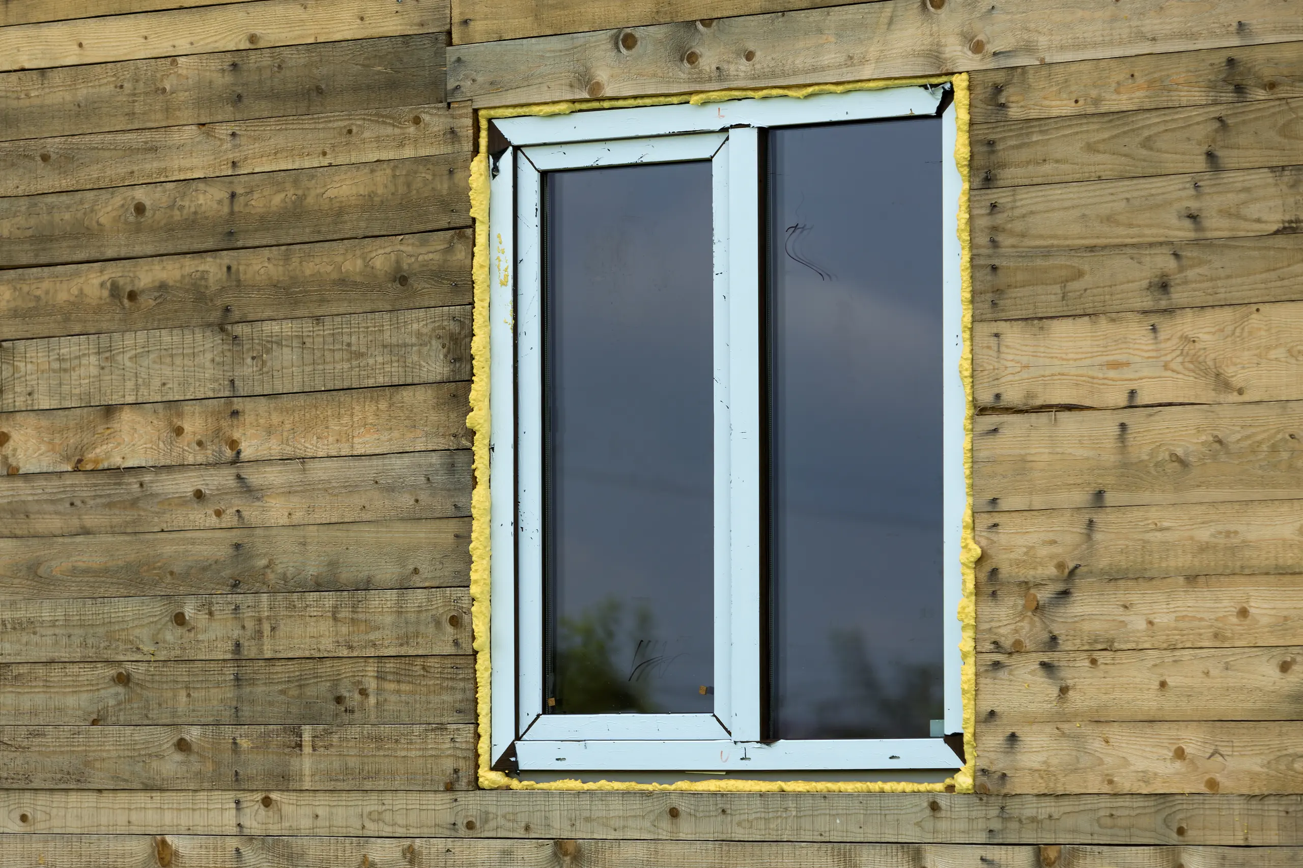 A new uPVC window installed in a wooden structure for home refurbishment